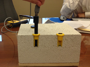 Thermo-hygrometer probes in a cross-section of concrete.