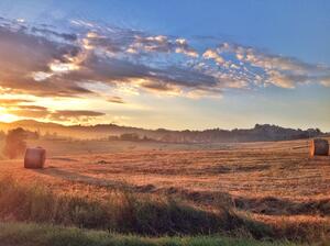 Farmers often start baling their hay before the sun is even up in order to get the largest yield of hay they can for that day.