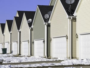 Building conformity Row of nearly identical one-car garages in winter.jpeg