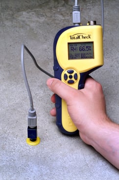 A TotalCheck 3-in-1 meter attached to an in-situ concrete RH probe.